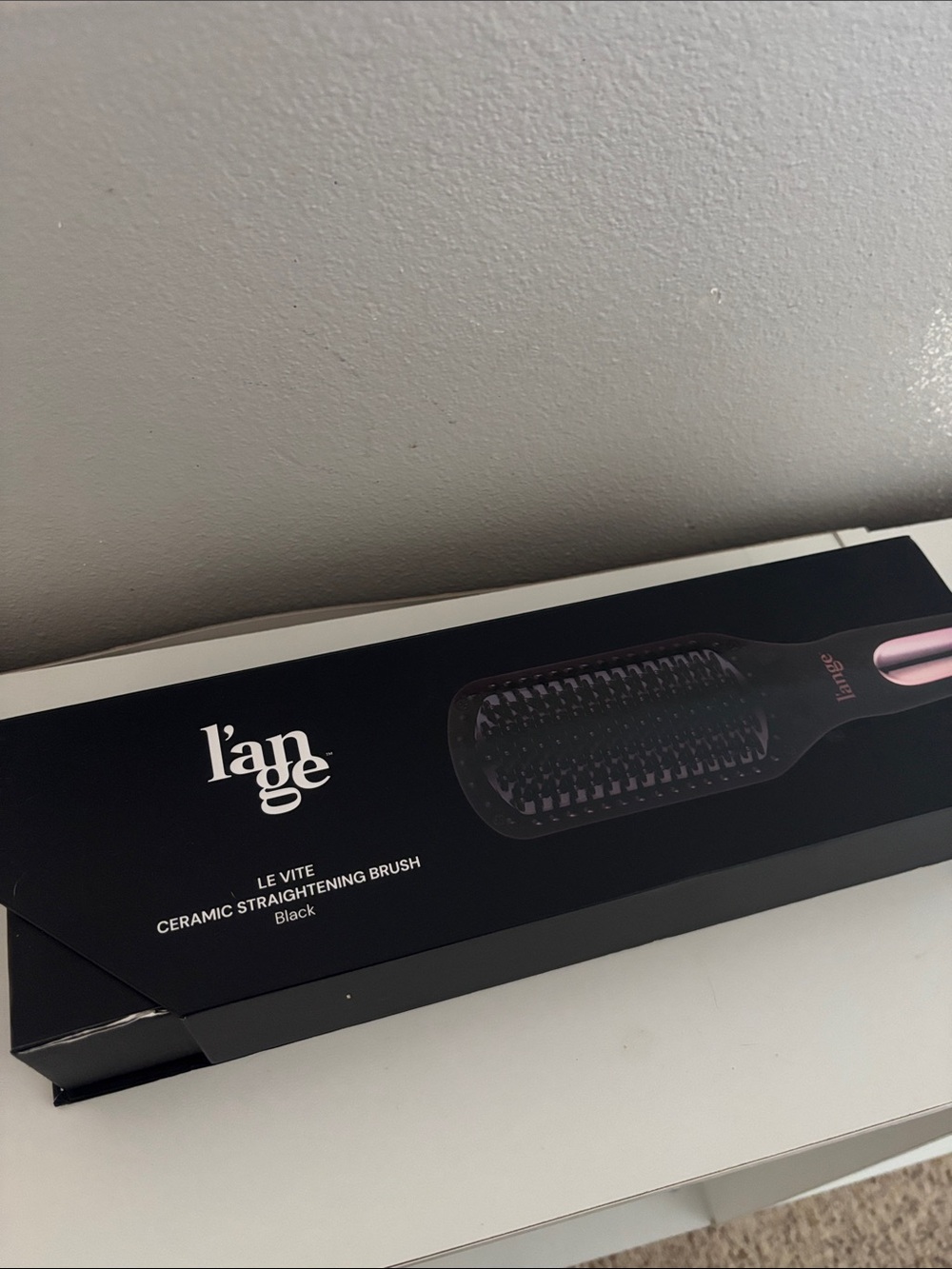 Lange Black Hair Tool Packaging with White Text